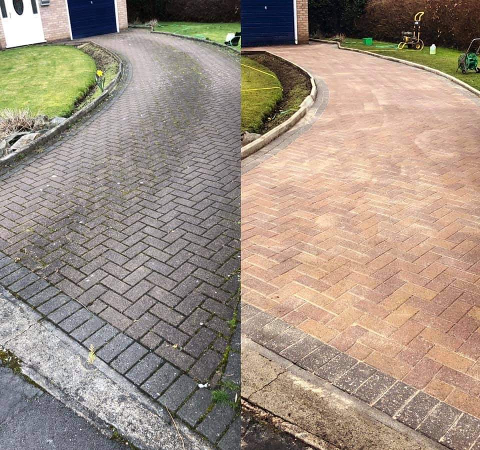 Before and after of a pressure washed block driveway.